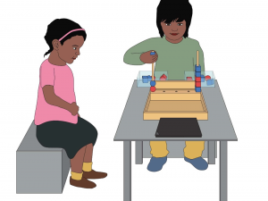 Study set up, two children at table with blocks activity