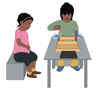 Study set up, two children at table with blocks activity