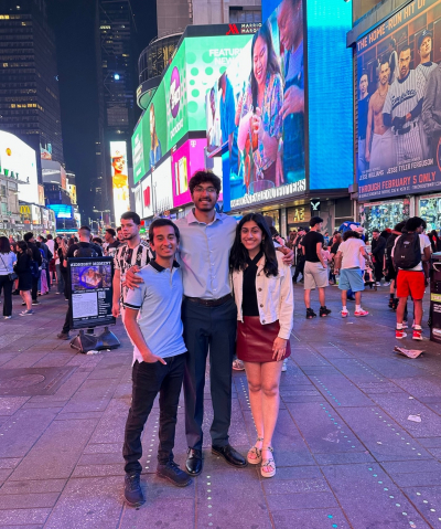 Shah, Ghanta, and Jotsinghani in New York City's historic Time Square.